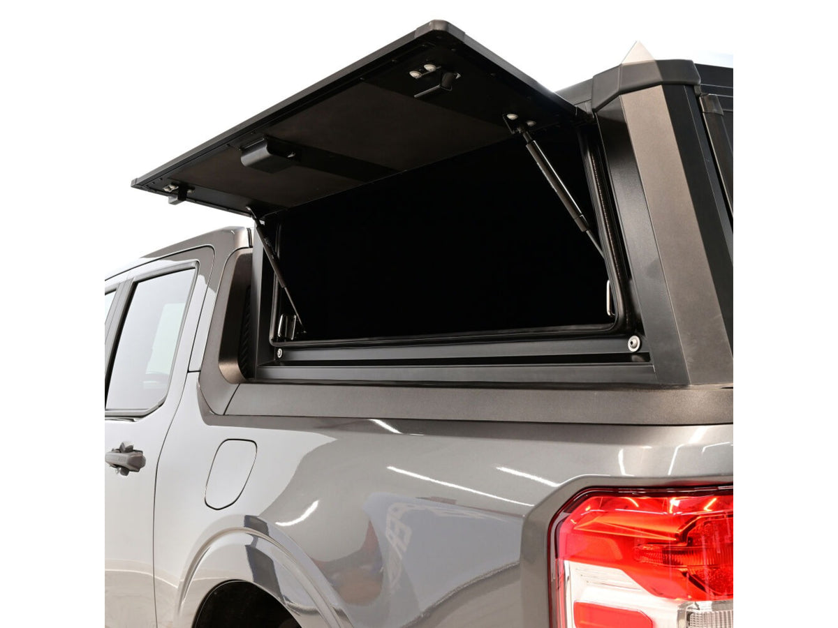 Open truck bed cover on a white vehicle with a clear background