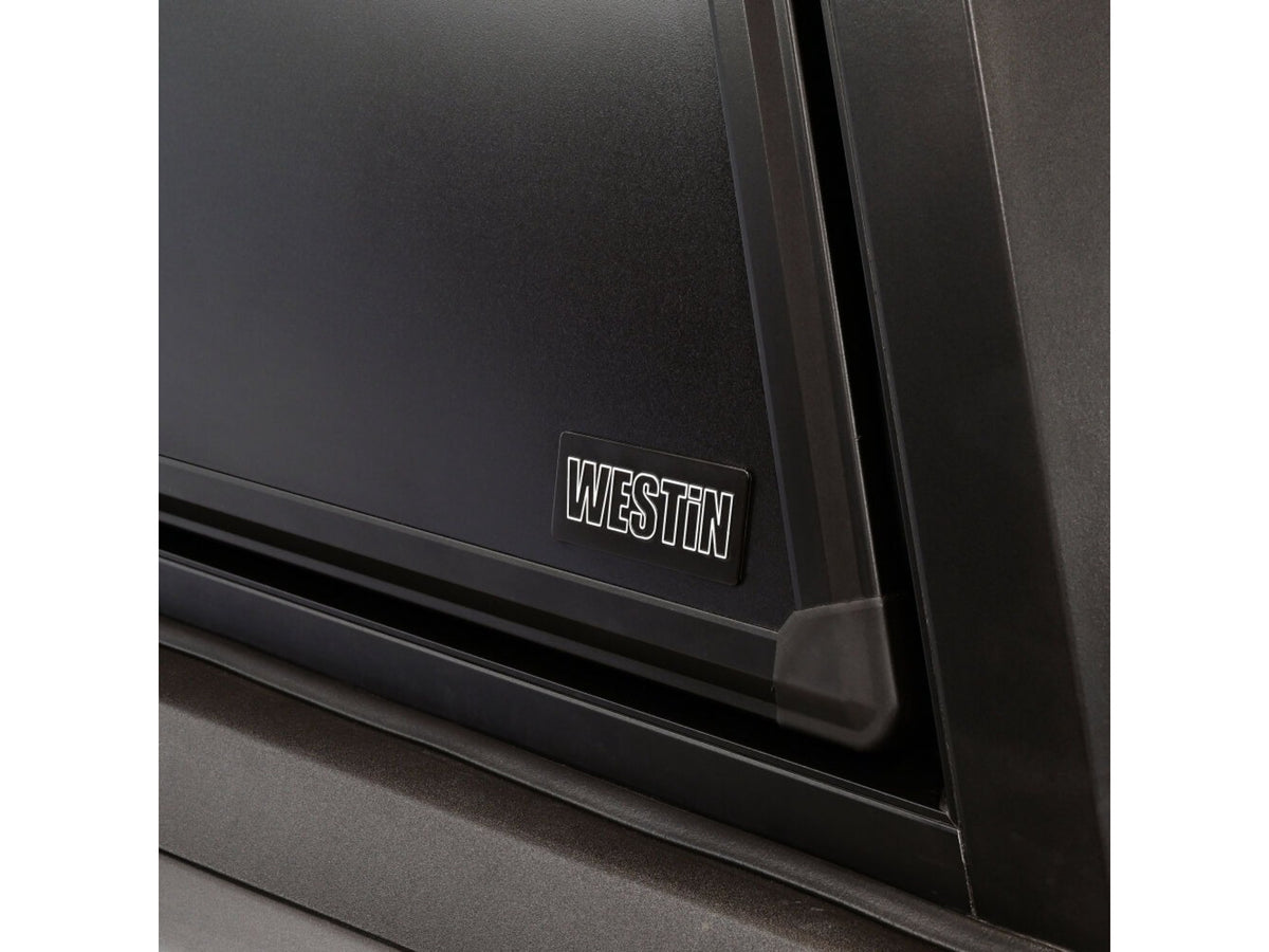 Close-up of a black appliance with 'Weston' branding on a white background