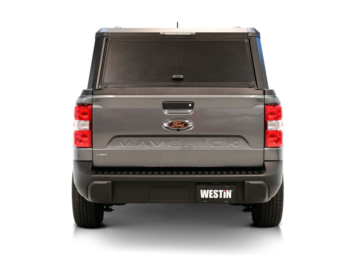 Back view of a Ford F-150 with a WestinEXP Truck Cap Hi-Top with Solid Front Glass Matte Black