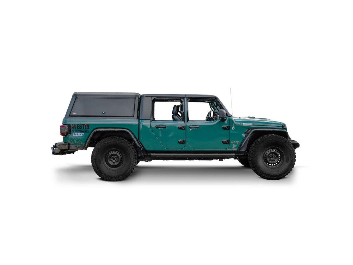 Green Jeep Gladiator with westin exp truck cap on a white background