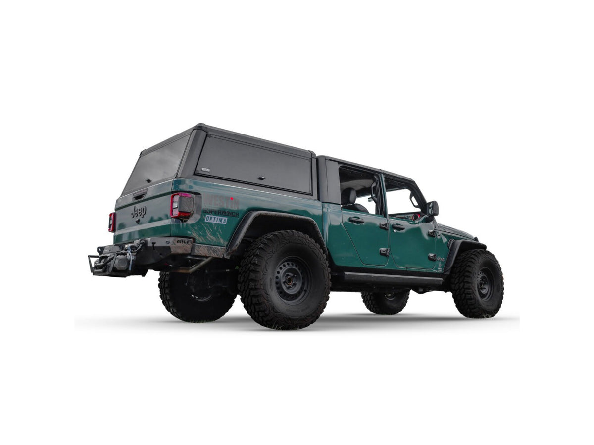 Green Jeep Gladiator with westin exp truck cap on a white background